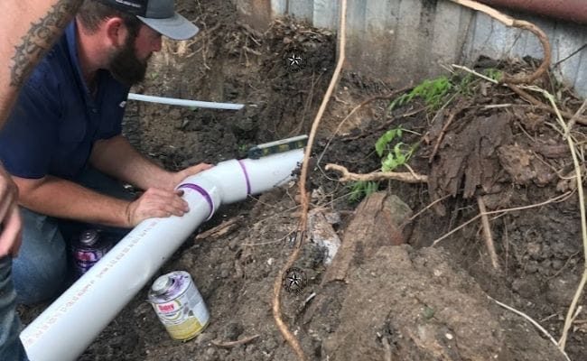Ranger Plumbing Company plumber installing pipes in Richmond TX